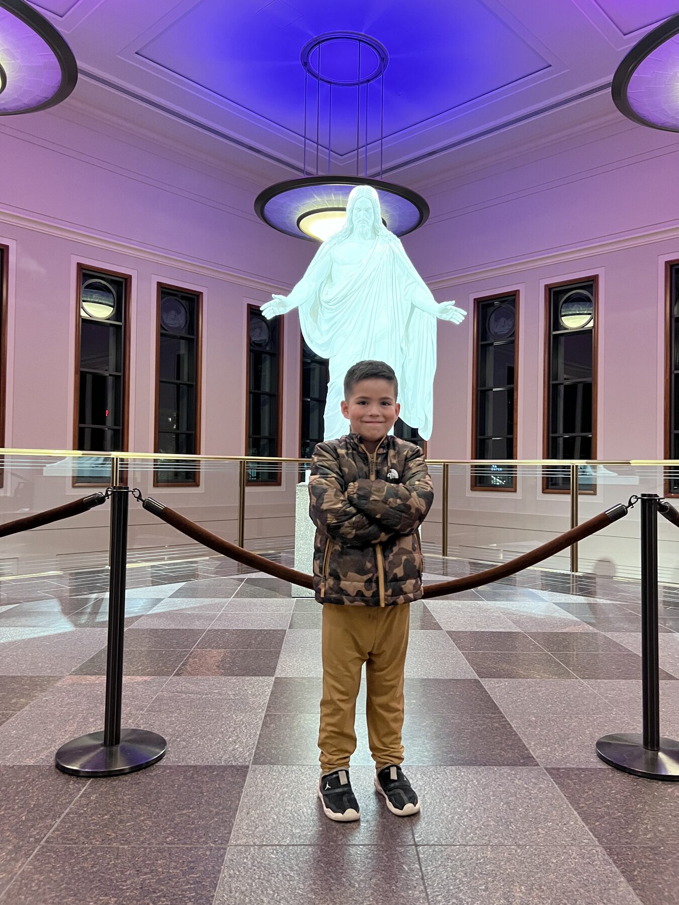 Oliver standing in front of the Christus statue.